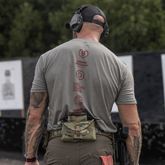 GBRS Group Axes Short Sleeve Shirt - Lifestyle shot showing back of shirt on a male at the range