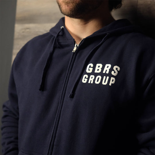 GBRS Group Patriotism Isn't Dead Zip Up Hoodie on a model showing Screen printed left chest GBRS Group stacked design
