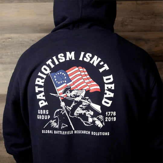 GBRS Group Patriotism Isn't Dead Zip Up Hoodie on a model showing Screen printed Patriotism Isn't Dead center backprint design