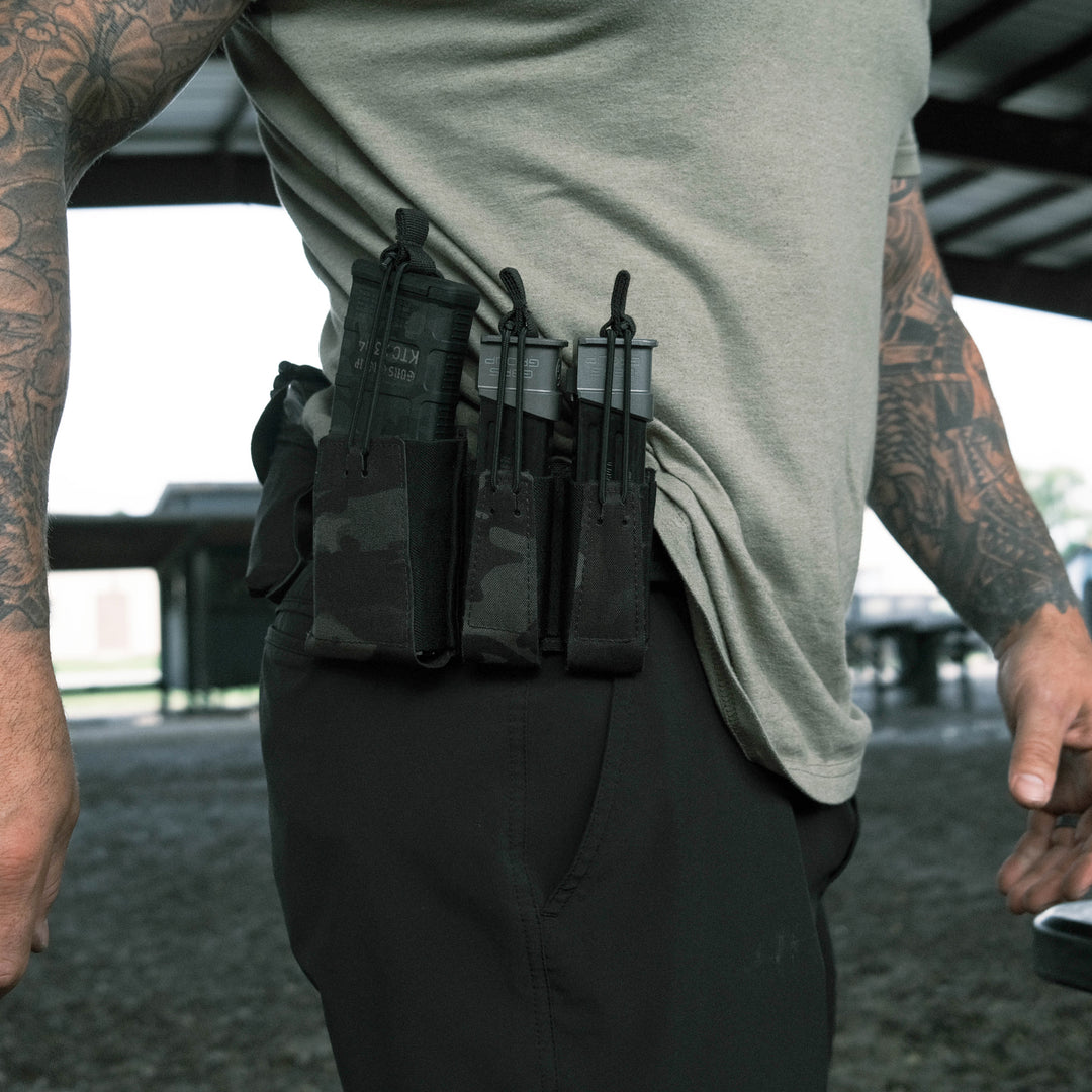 The GBRS Group Double Pistol Magazine Pouch with Bungie Retention. Squadron laminate and thick poly elastic material allow for a smooth draw, positive retention and easy reinsertion. MOLLE/BELT compatible pouch will fit most double-stacked pistol magazines. 