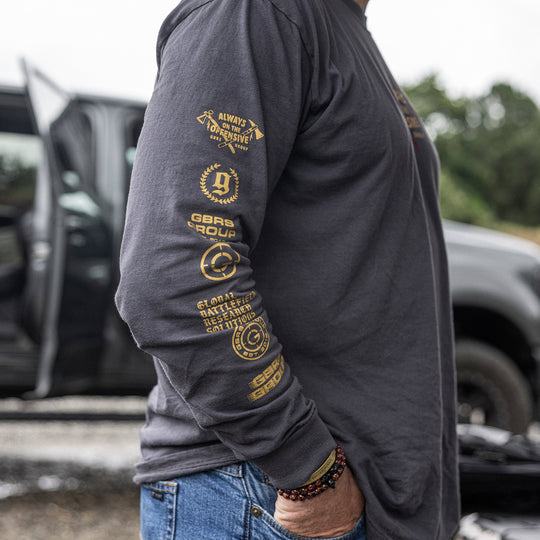 GBRS Group Axes Long Sleeve Shirt - lifestyle shot showing the sleeve with logos - lifestyle shot on a male outdoors