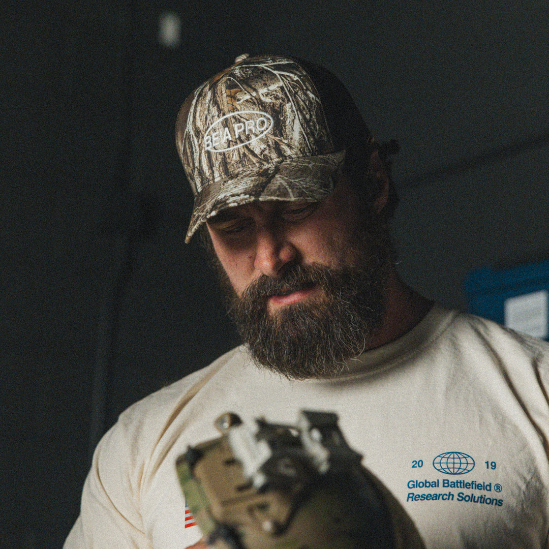 GBRS Group Be A Pro Trucker Hat in Realtree Camo - lifestyle image showing front of hat
