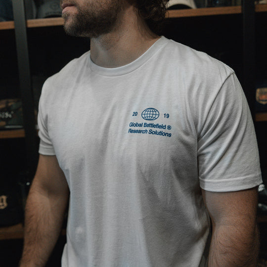 GBRS Group Intl Be A Pro Short Sleeve Shirt pictured in lifestyle shot showing the white shirt left front chest screenprint design