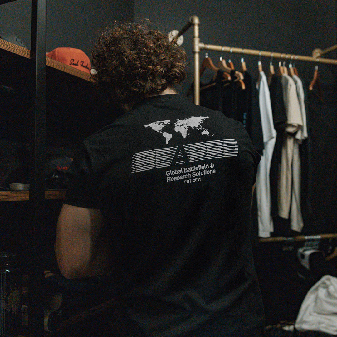 GBRS Group Intl Be A Pro Short Sleeve Shirt pictured in lifestyle shot showing the black shirt back screenprint design