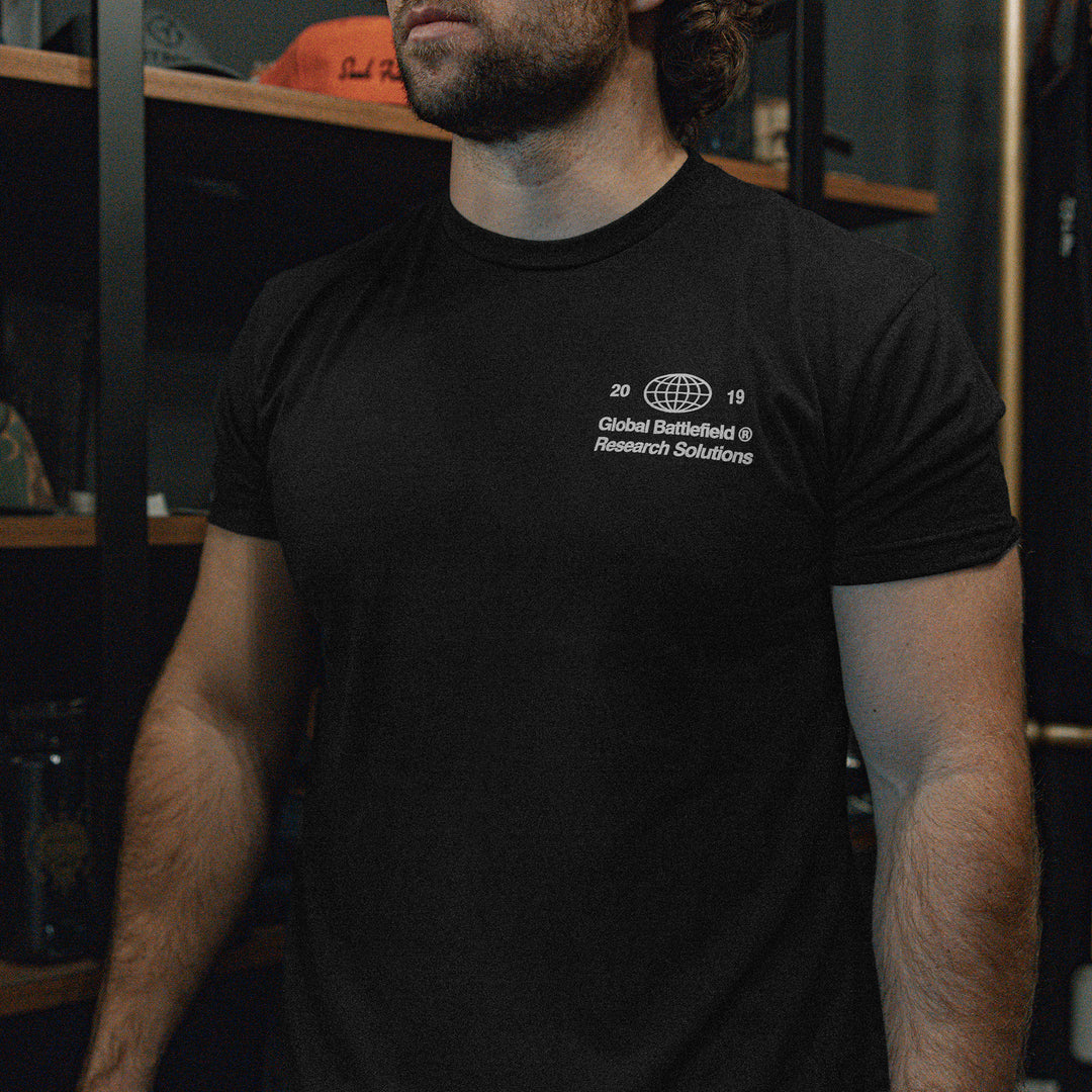 GBRS Group Intl Be A Pro Short Sleeve Shirt pictured in lifestyle shot showing the black shirt front left chest screenprint design