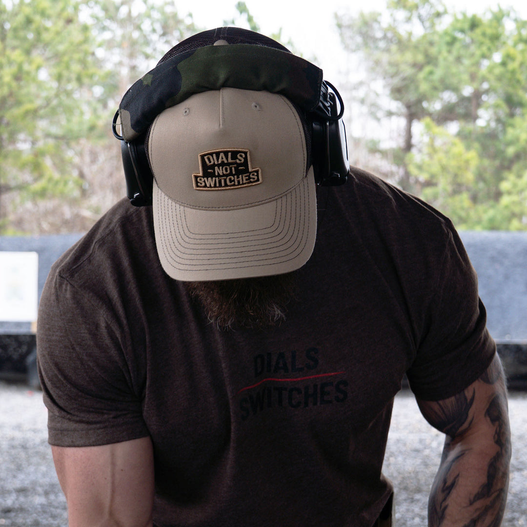 GBRS Group Badge Trucker Hat in Khaki  - Front View Lifestyle shot at the range