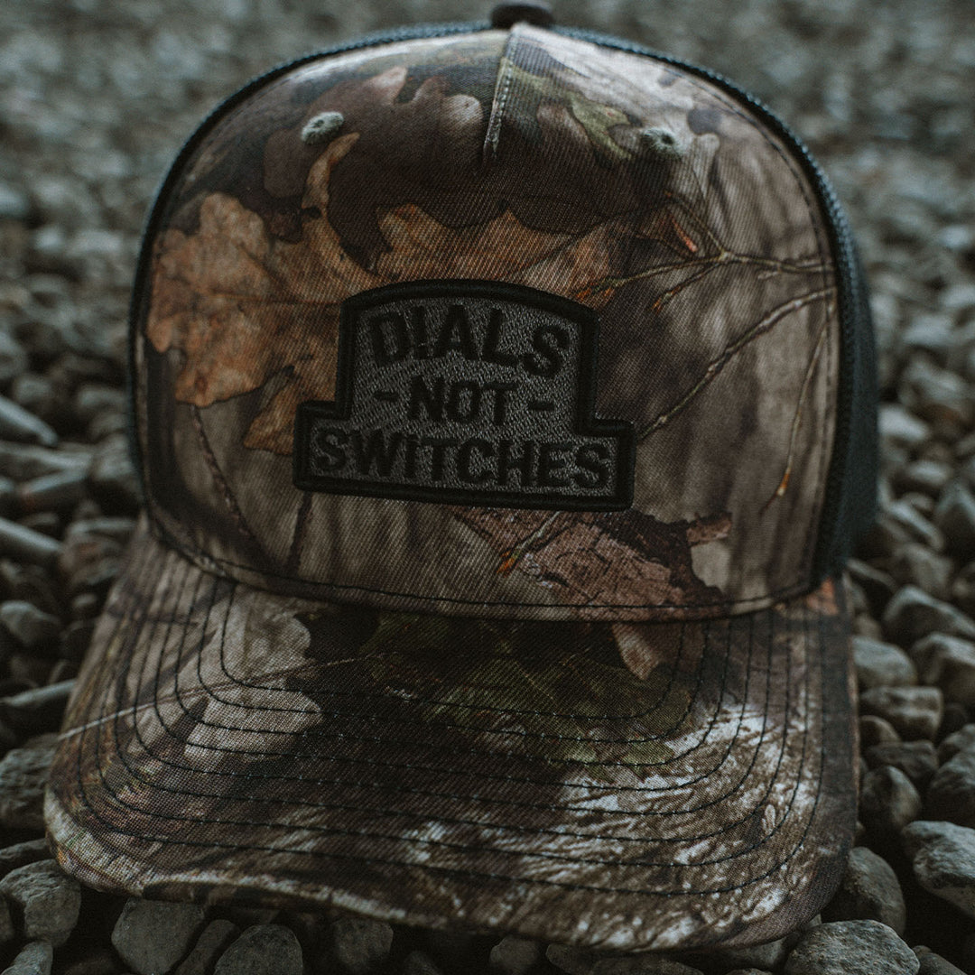 GBRS Group Badge Trucker Hat in Mossy Oak - Front Lifestyle shot