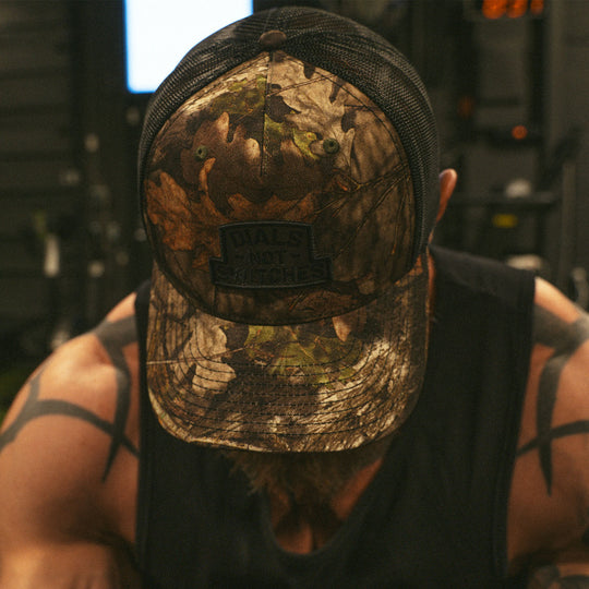 GBRS Group Badge Trucker Hat in Mossy Oak - Front Lifestyle Shot