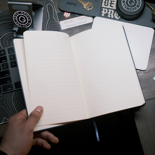 The Textured Be A Pro Field Book is constructed of a dual-textured hardcover with a faux leatherette band and features a pen loop on the spine, 80GSM Ivory ruled paper with date field, 96 sheets (192 pages) and ribbon bookmark.