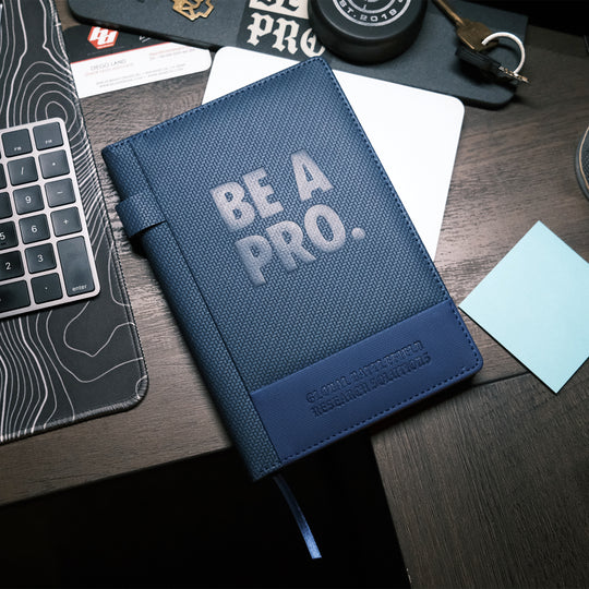 The Textured Be A Pro Field Book is constructed of a dual-textured hardcover with a faux leatherette band and features a pen loop on the spine, 80GSM Ivory ruled paper with date field, 96 sheets (192 pages) and ribbon bookmark.