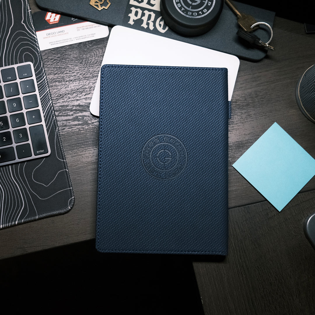 The Textured Be A Pro Field Book is constructed of a dual-textured hardcover with a faux leatherette band and features a pen loop on the spine, 80GSM Ivory ruled paper with date field, 96 sheets (192 pages) and ribbon bookmark.