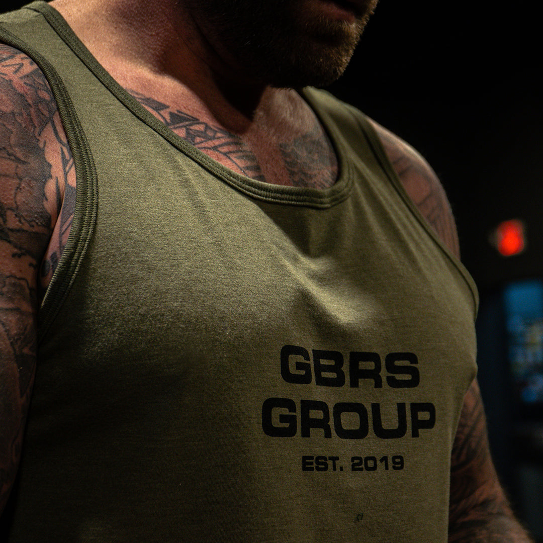 GBRS Group Instructor Tank - Anniversary Edition has a Slightly tapered athletic fit.
Pictured in Olive - Lifestyle at the gym