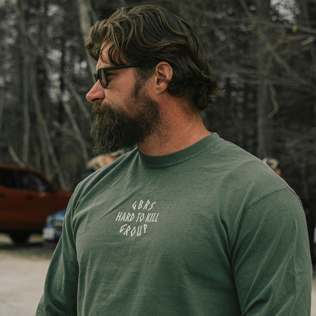 Model wearing the GBRS Group Hard to Kill Long Sleeve and eye protection clear glasses outdoors