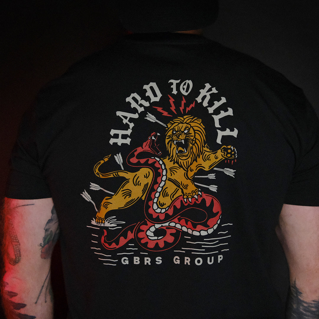 GBRS Group Hard To Kill Short Sleeve Shirt - Back of black tee shirt worn by a man with tatoos. 