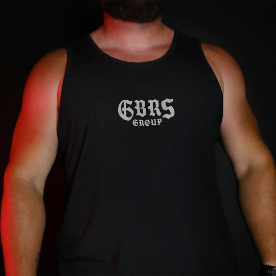 GBRS Group Hard To Kill Tank on a man's body showing front of tank in a dark room