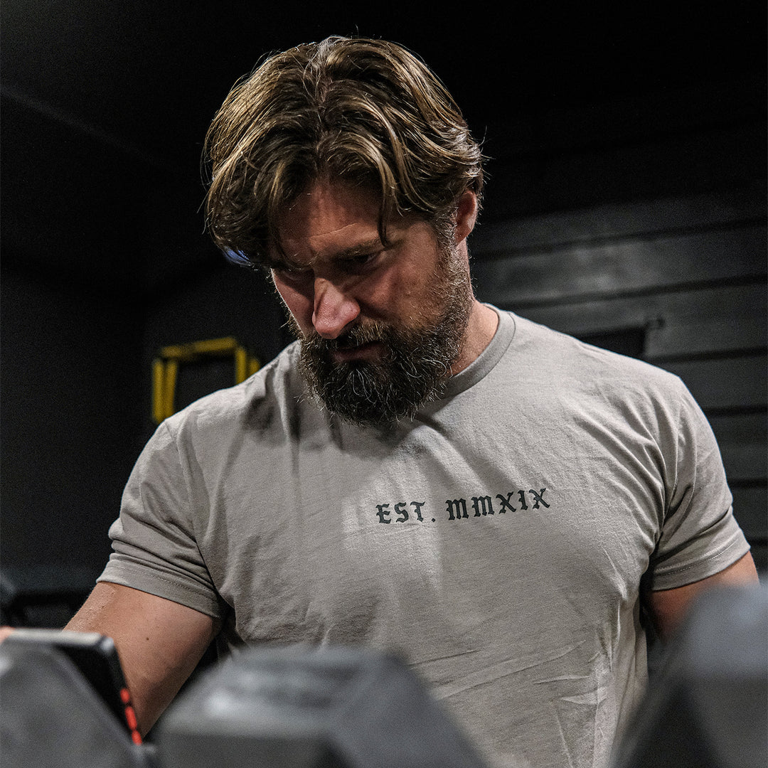 GBRS Group Lion And Skull Short Sleeve Shirt - front of shirt on a man in a gym