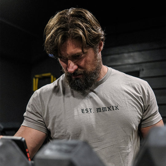 GBRS Group Lion And Skull Short Sleeve Shirt - front of shirt on a man in a gym