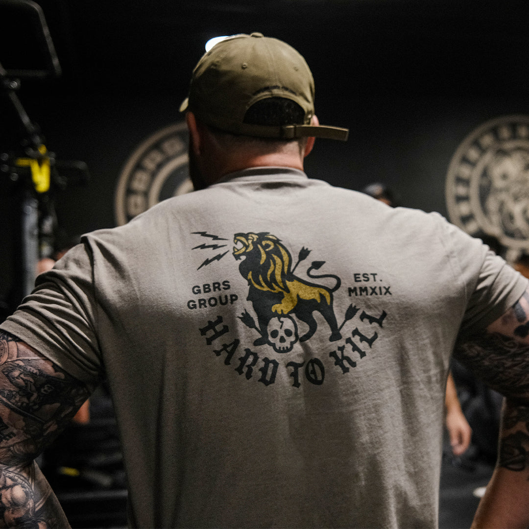 GBRS Group Lion And Skull Short Sleeve Shirt - Back of shirt on a man in a gym
