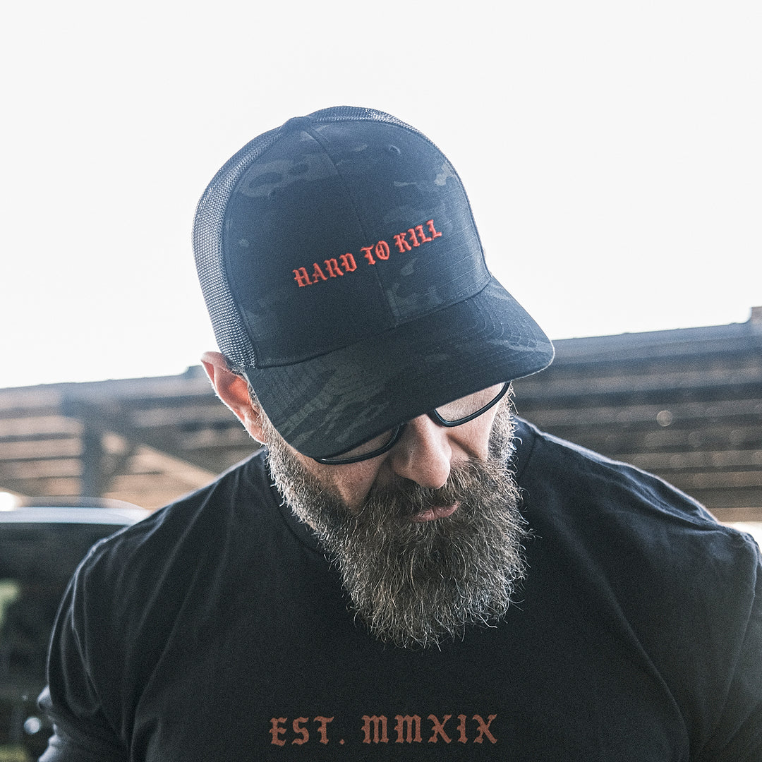 GBRS Group Multicam Hard To Kill Tactical Trucker Hat - Richardson 862 Tactical Trucker with NYCO ripstop fabric - Man wearing hat showing the front in a lifestyle range photo
