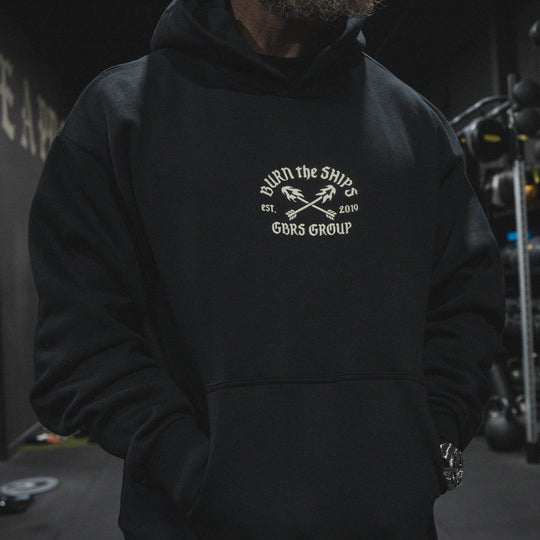 GBRS Group No Retreat Oversized Pullover Hoodie- Lifestyle image in a gym  showing front of hoodie