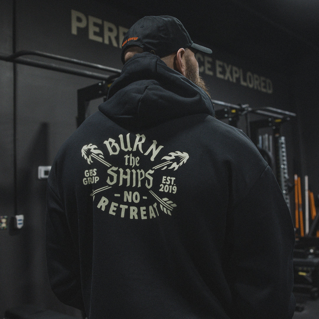 GBRS Group No Retreat Oversized Pullover Hoodie- Lifestyle image in a gym showing back of hoodie