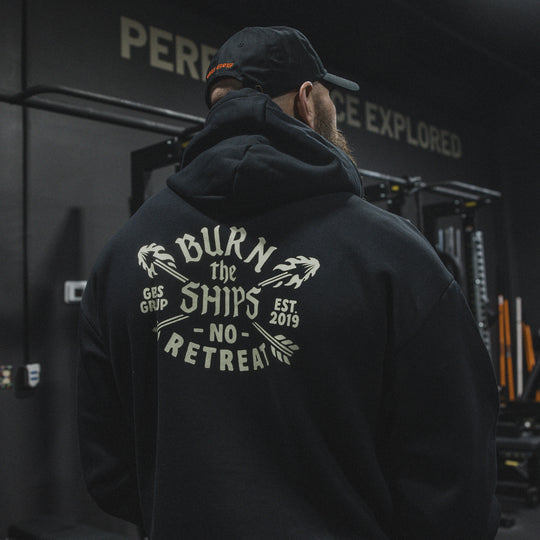 GBRS Group No Retreat Oversized Pullover Hoodie- Lifestyle image in a gym showing back of hoodie