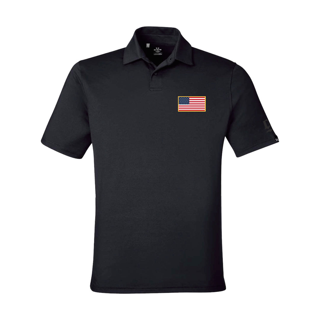GBRS Group Patriotism Polo Shirt - Left chest American Flag rubberized thermal graphic. Embroidered GBRS "g" logo on the left sleeve. Pictured front of black polo on a white background. 