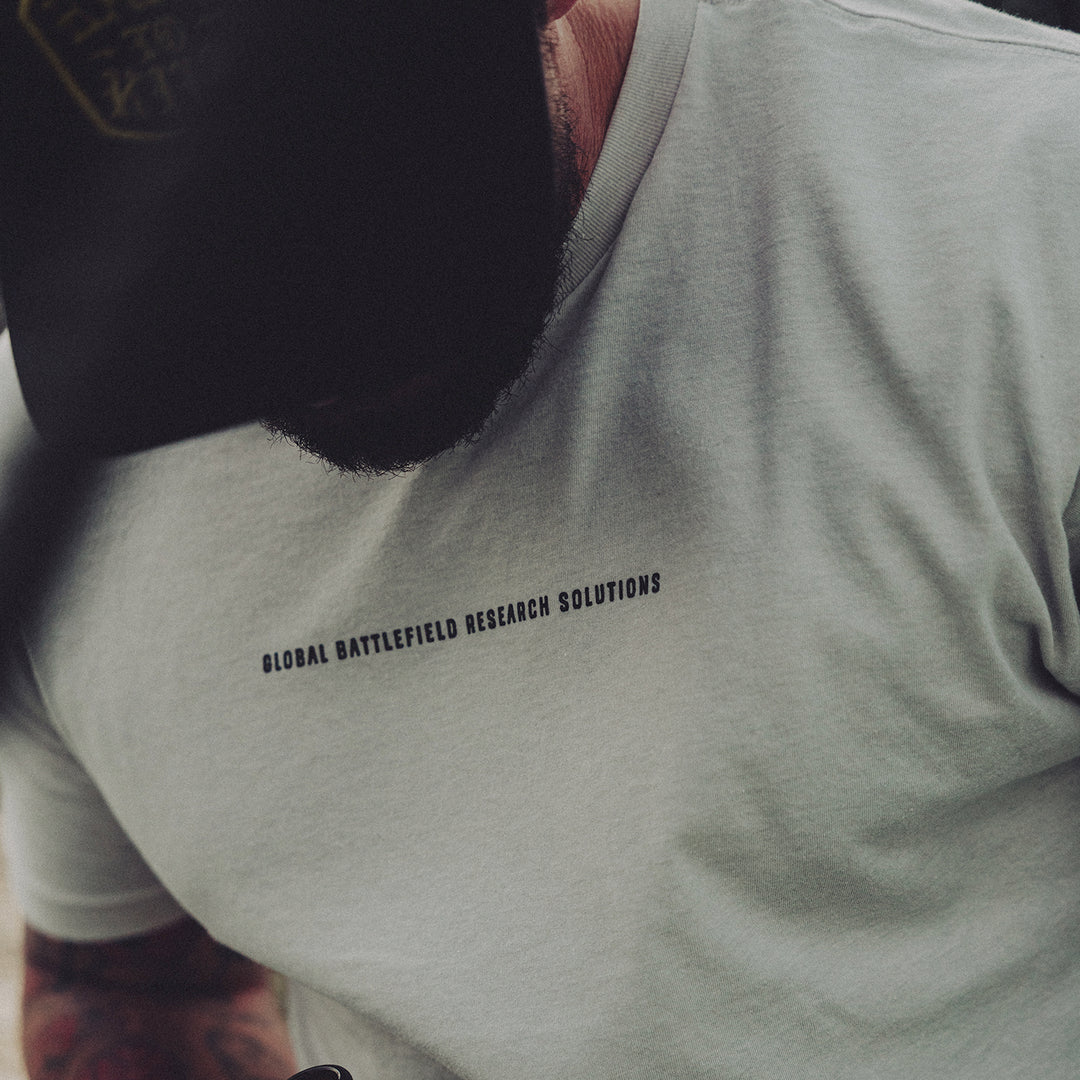 GBRS Group Storming The Beach Short Sleeve Shirt in tan with Black center print shown on body.