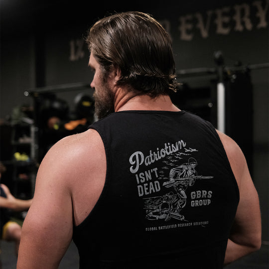 GBRS Group Storming the Beach Tank - Lifestyle shot in a gym showing back of tank with screen printed center back Storm The Beach design