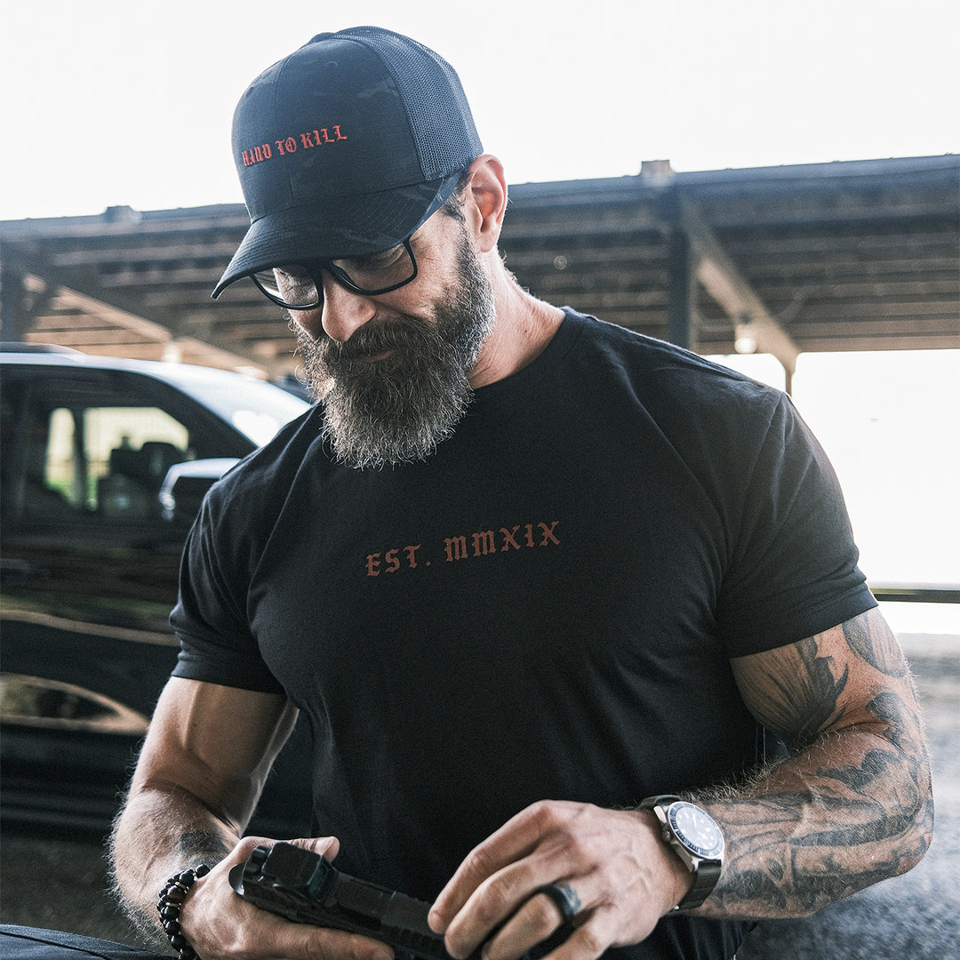 GBRS Group Triple Daggers Short Sleeve Shirt - Front of shirt on a man's body at a range
