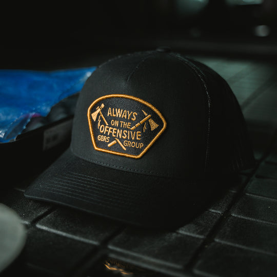 GBRS Group Axes Trucker Hat - Lifestyle image in back of truck bed