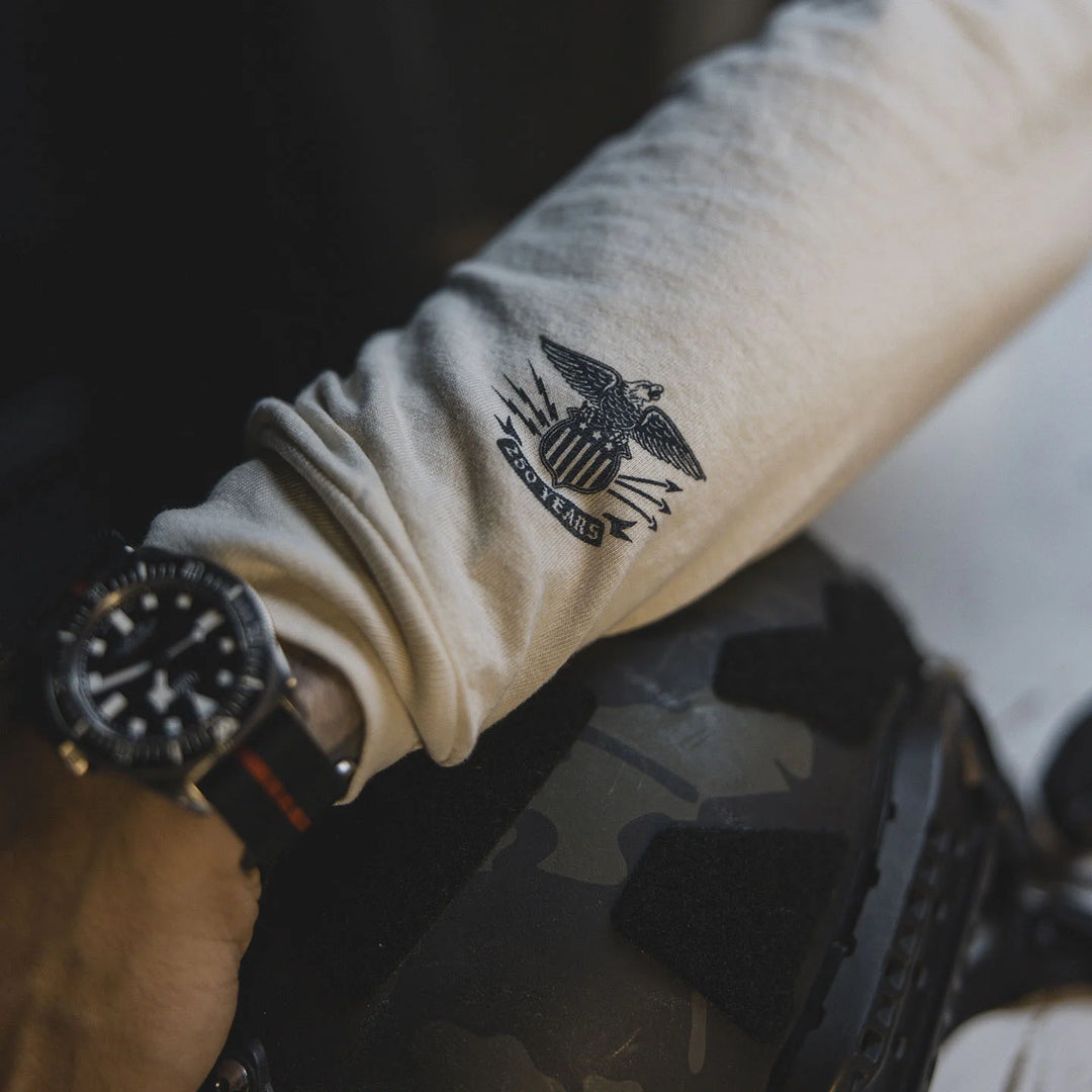 Close-up of the wrist on the GBRS Group Front and Center Long Sleeve Shirt featuring an eagle and shield design