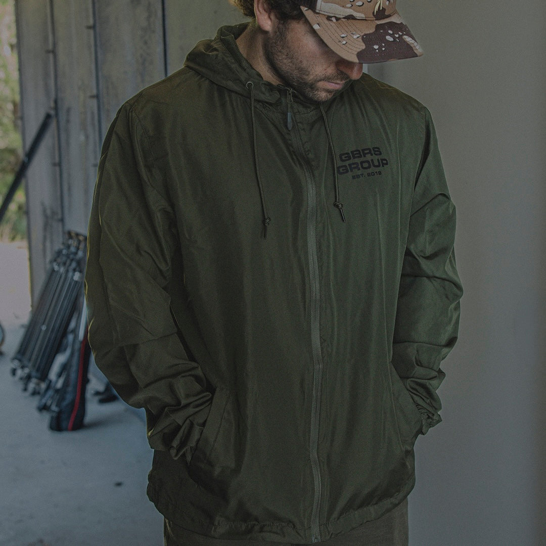 Man wearing the GBRS Group Instructor Windbreaker Jacket outdoors