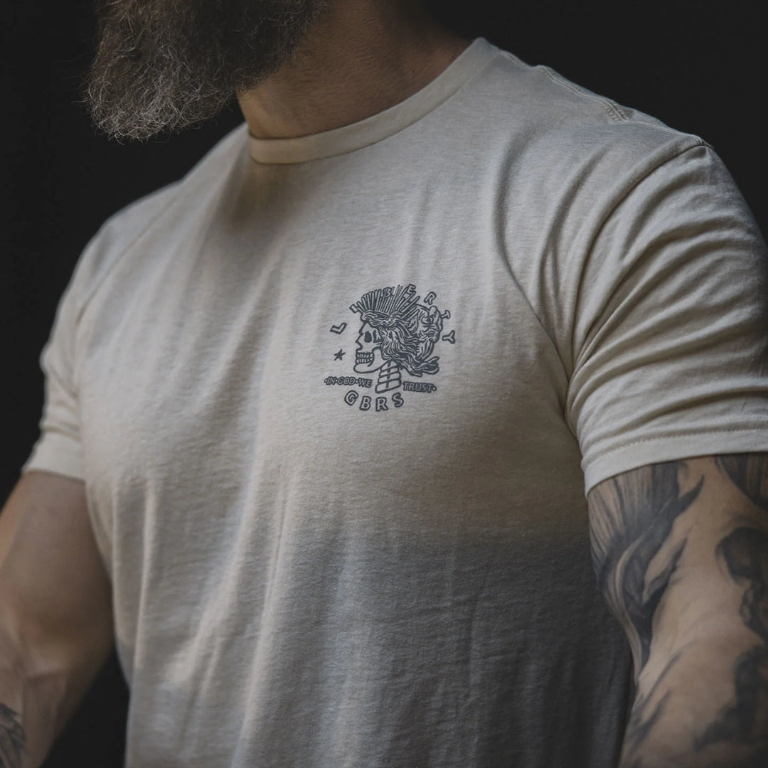Man wearing the GBRS Group Lady Liberty Short Sleeve Shirt in a dark background