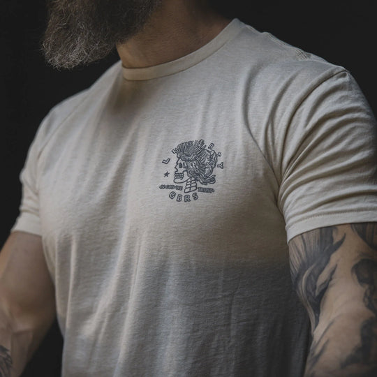 Man wearing the GBRS Group Lady Liberty Short Sleeve Shirt in a dark background