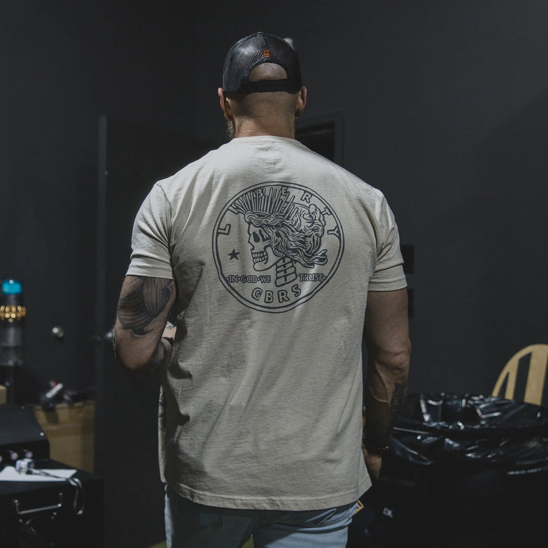 Man wearing the GBRS Group Lady Liberty Short Sleeve Shirt, walking out of a room.