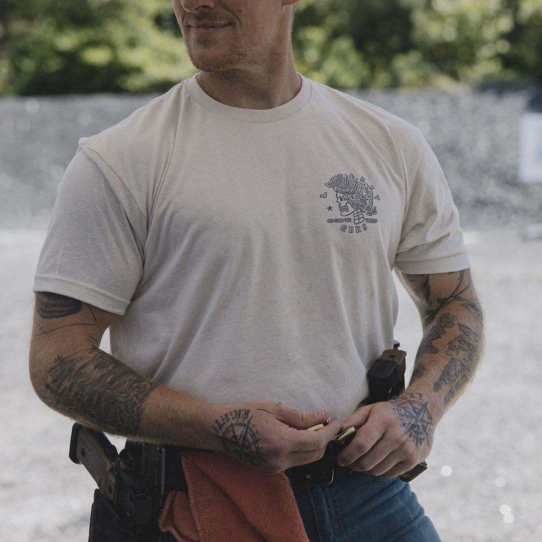 Man wearing the GBRS Group Lady Liberty Short Sleeve Shirt, at an outdoor range.