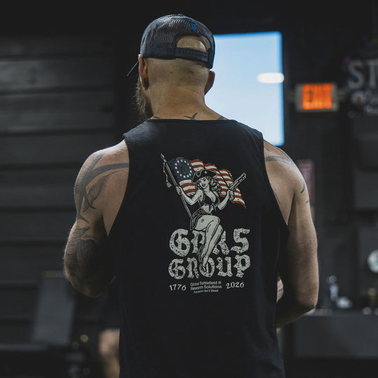 Person wearing the GBRS Group Lead and Lace Tank, standing in a gym.