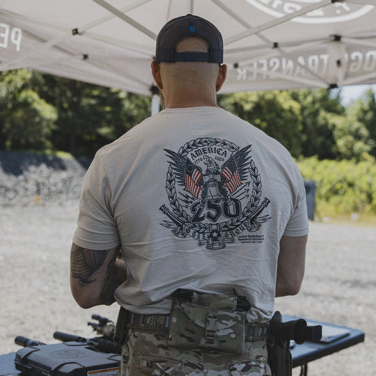 Man facing away from camera and wearing a cap and the GBRS Group Semper Fortis Short Sleeve Shirt outdoors.
