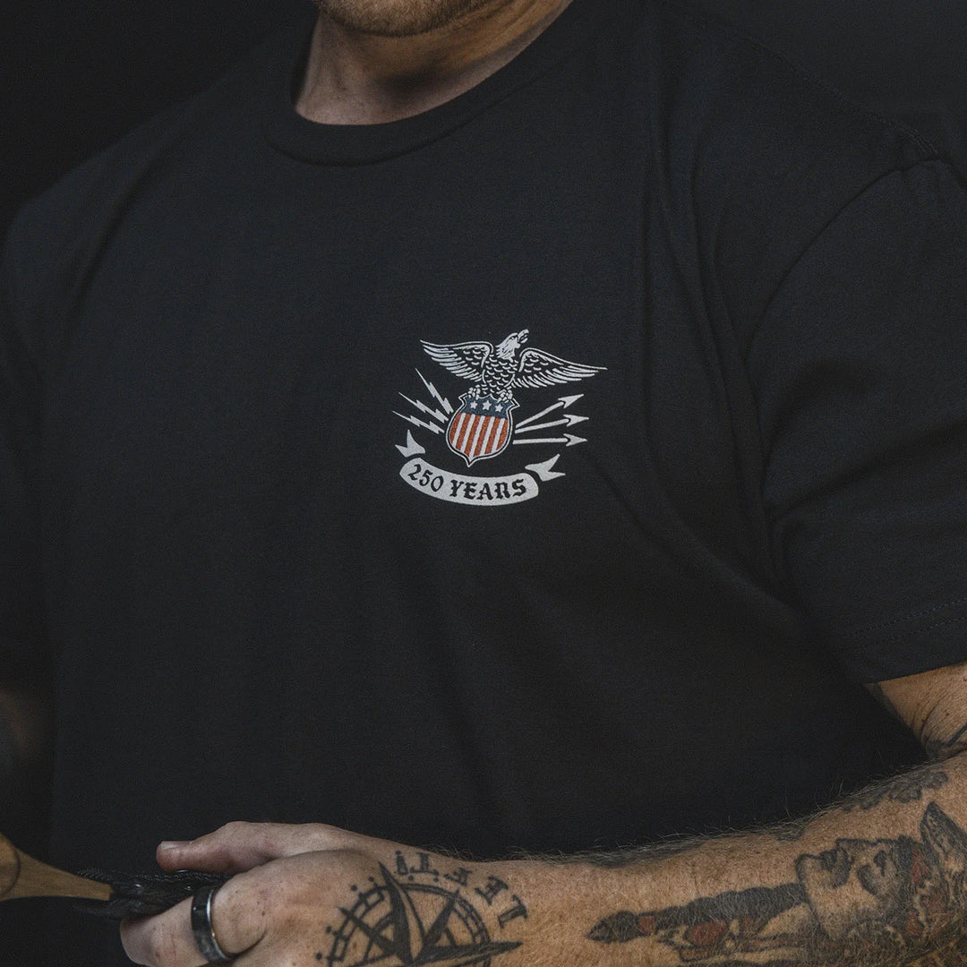 Up close image of the GBRS Group Test of Time Short Sleeve Shirt with an eagle emblem and '250 Years' text on the front.