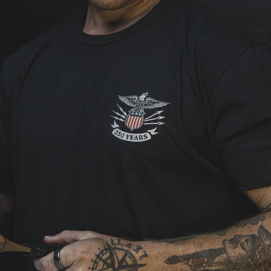 Up close image of the GBRS Group Test of Time Short Sleeve Shirt with an eagle emblem and '250 Years' text on the front.