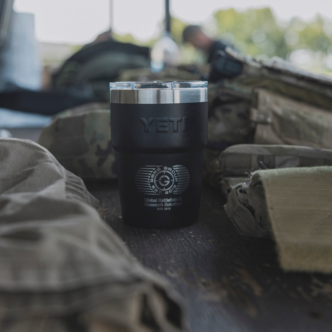 A GBRS Yeti cup surrounded by tactical gear