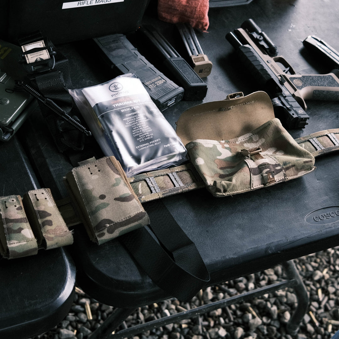 GBRS Group IFAS (Individual First Aid System) Pouch - Showing on a belt, laying on a table, ready to fill