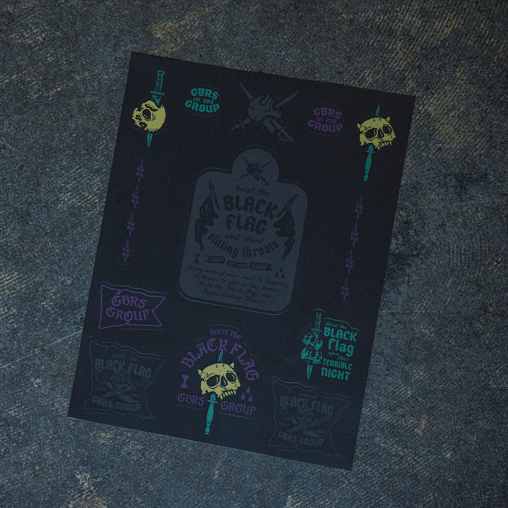 GBRS Group Black Flag Sticker Sheet - Pictured on cement surface showing entire sheet.