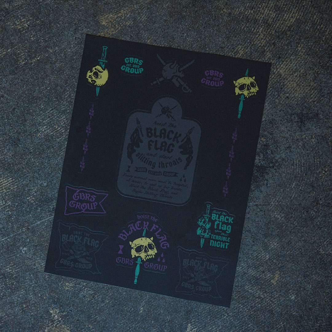 GBRS Group Black Flag Sticker Sheet - Pictured on cement surface showing entire sheet.