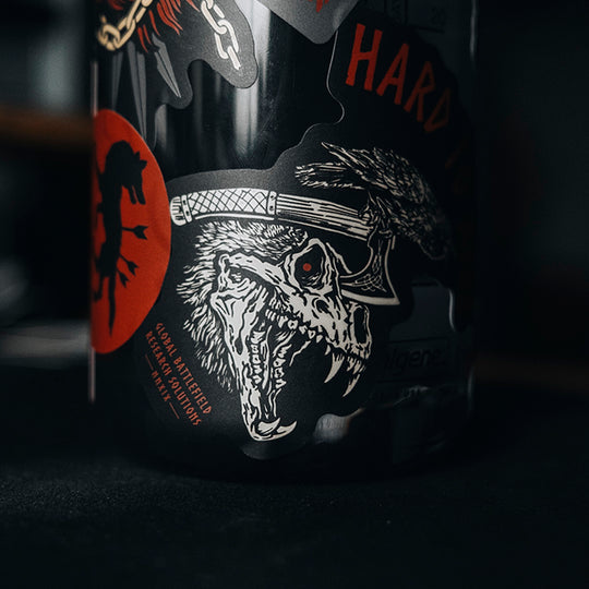 GBRS Group Hard to Kill Nalgene Water Bottle with GBRS Hard to Kill Stickers covering the bottle in a gym setting